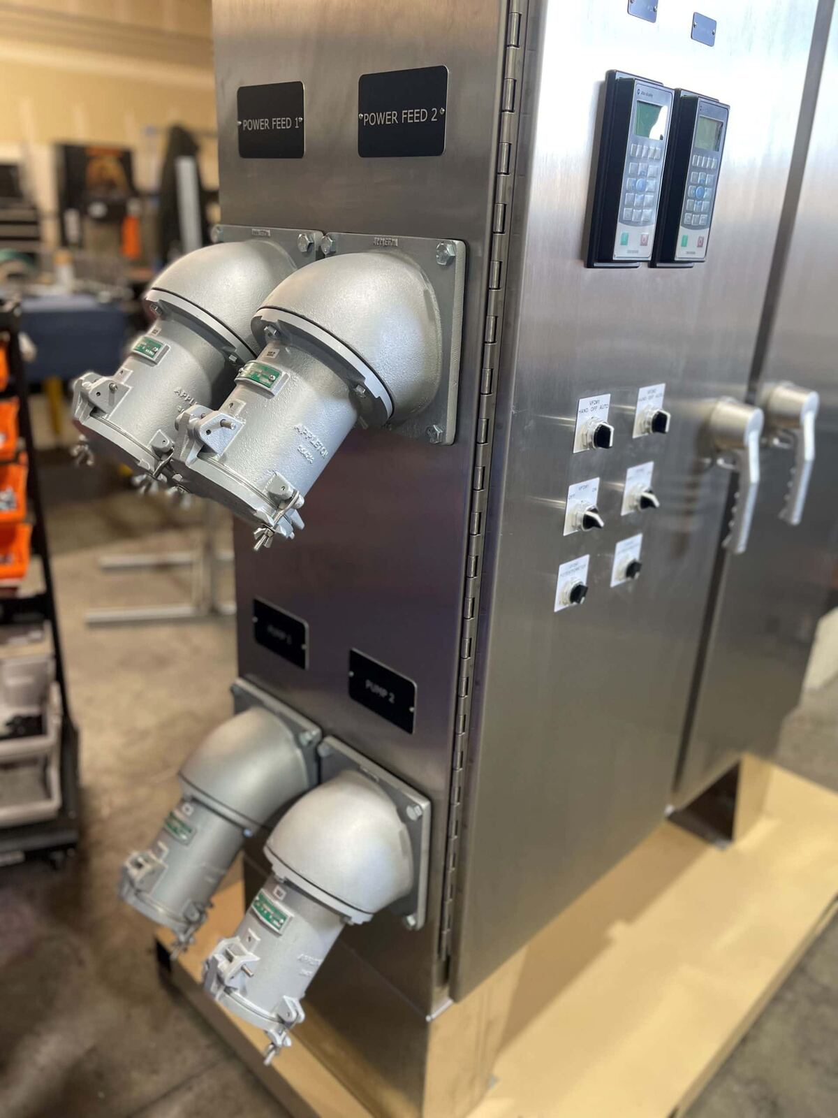 Finished stainless steel control panel with hazardous-location connectors and VFD keypads