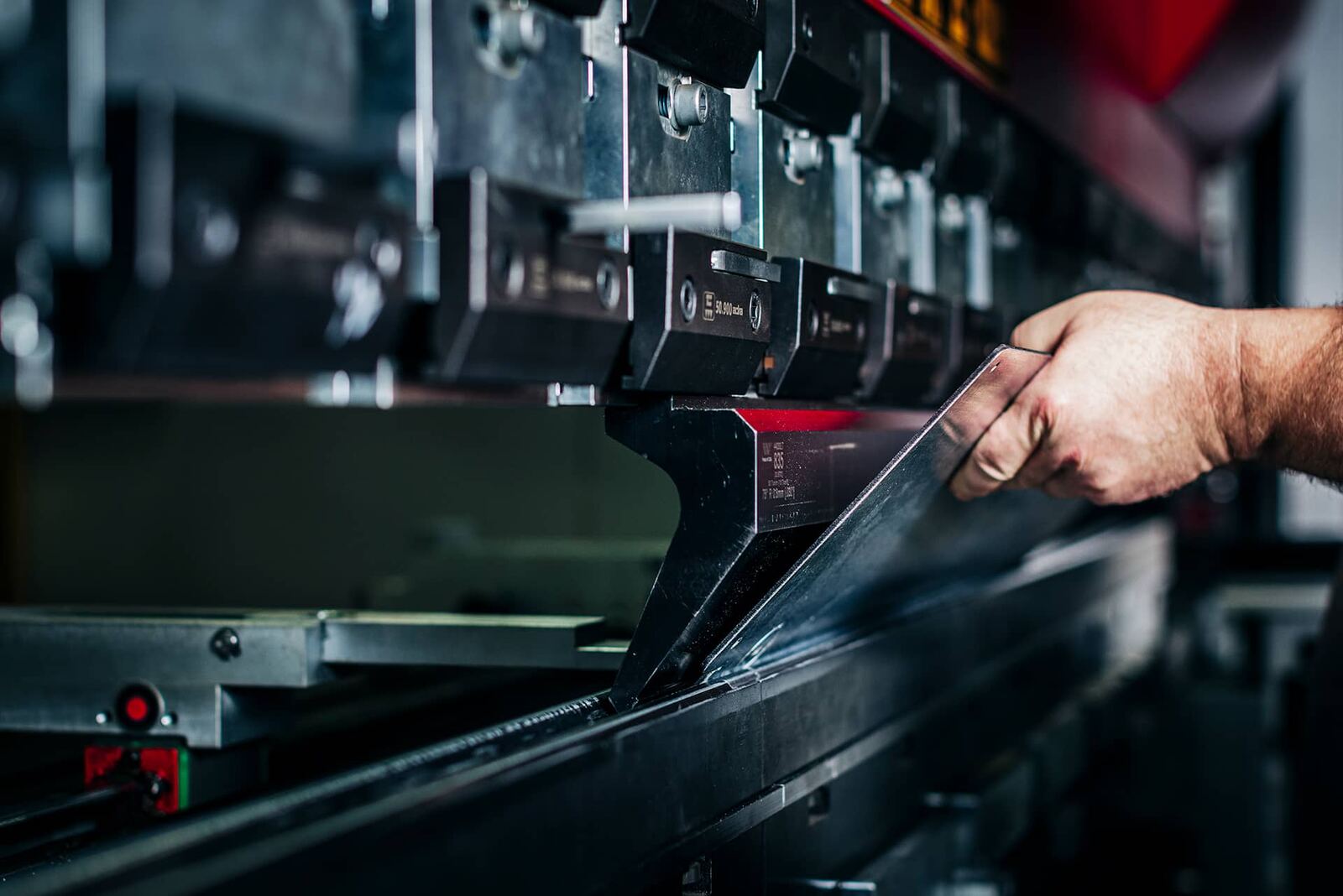 Sheet metal being formed on a press brake in Endpoint's shop